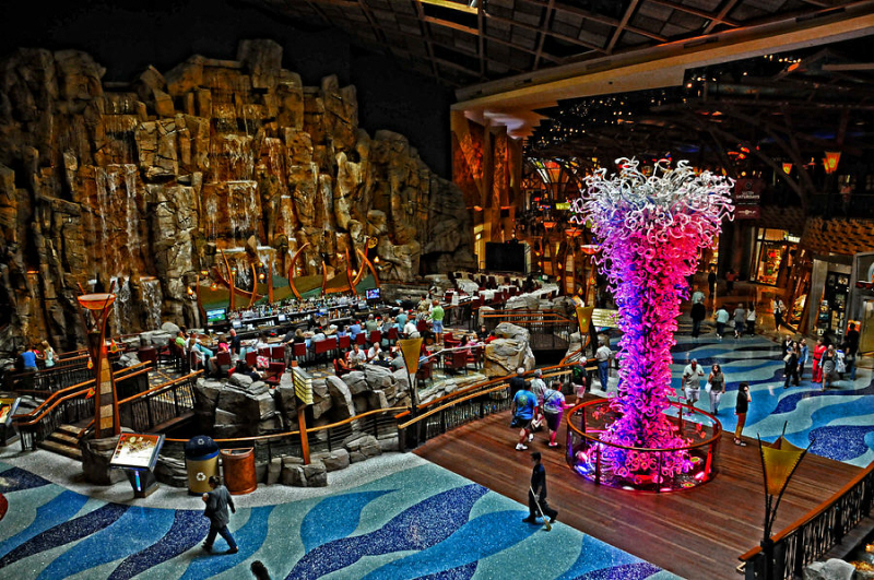 The ground floor makes you wish you lived in the casino. With rivers, waterfalls, rock walls, tiki torches, stages, and of course slot machines.
